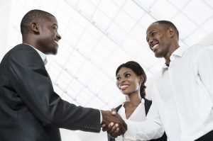 Three african business people handshake, Studio Shot, Cameroon